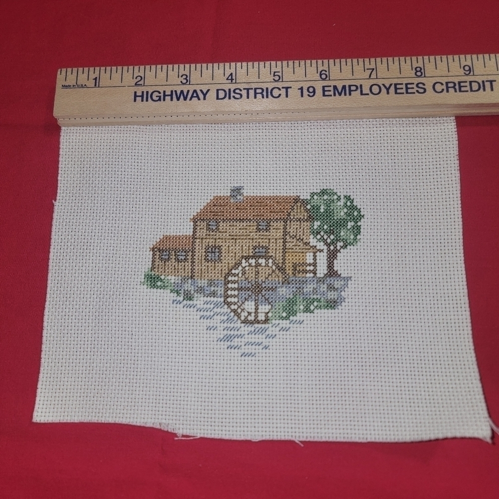 Cross-stitch handmade water building scene.  Just needs a frame.